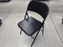 Black metal folding chair